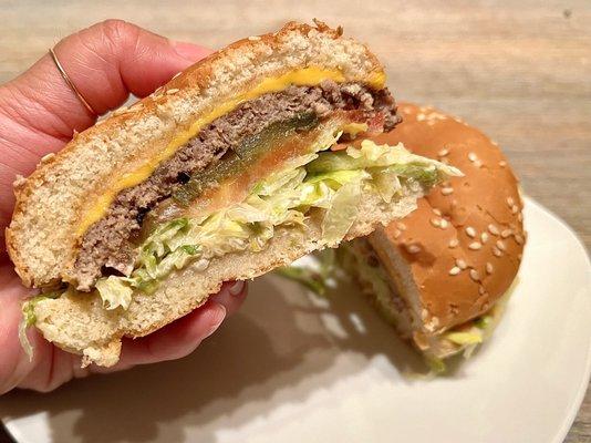 Cheeseburger. Beef patty, tomatoes, onions, cheese, lettuce, and thousand island sauce on a toasted bun. A great burger to try out!