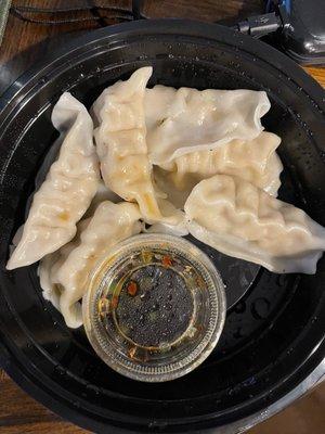 Steamed dumplings (was 8, ate 2) with nice (not overpowering) sauce