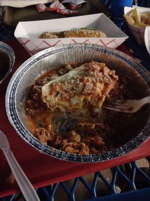 Home made lasagna  and comes with delicious bread.