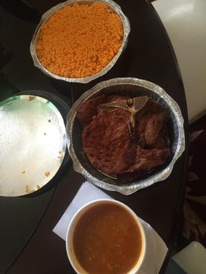 Fried pork chops, yellow rice and beans