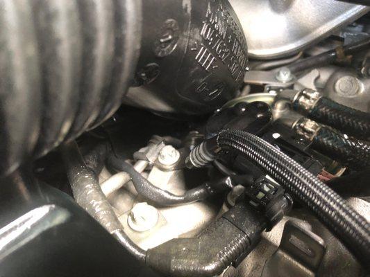 I sent this photo in showing where fuel was spewing out.  I was shocked they didn't find the defective clip!