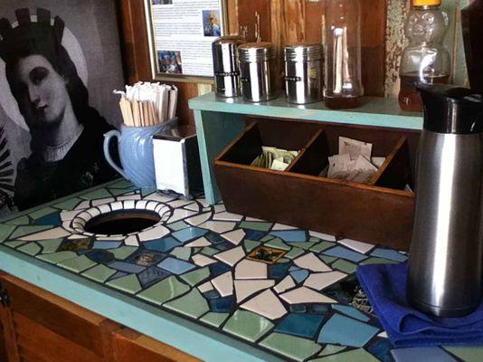 Custom mosaic countertop at Holy Grounds Coffee Shop by Ceramic Finishes.