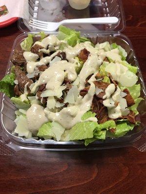 Steak tip Caesar salad with bacon, no croutons