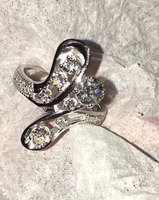 This beautiful ring was made for a client who had family heirloom pieces she wanted to incorporate into one platinum setting.