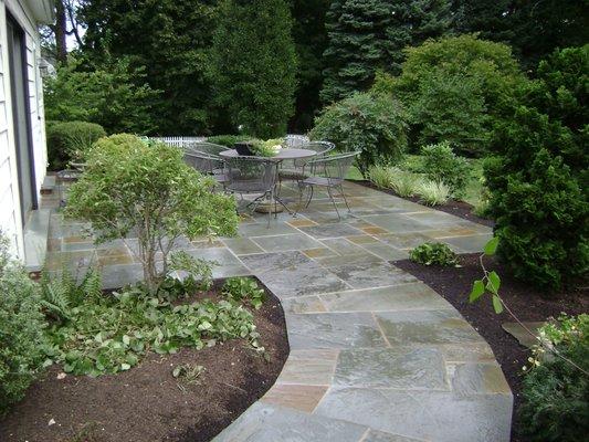 Backyard flagstone Patio with beds