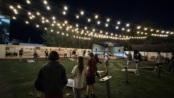 Corn hole and a stage in the back for live music