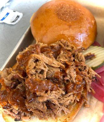 Pulled Pork sandwich with house barbecue sauce.