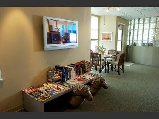 Reception area designed with the comfort of each patient in mind. Kids area with Arcade games, fish tank, youth books and fun...