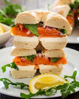 A bagel with cream cheese, salmon, and greens is a delicious and satisfying sandwich that combines a variety of flavors and textures