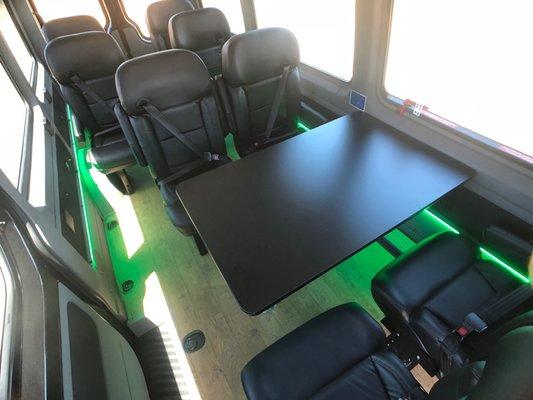 Bandago's Executive vans have reclining seats and desks for working.