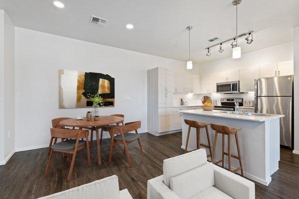 Kitchen island offers breakfast bar seating and plenty of space for dining area or home office!