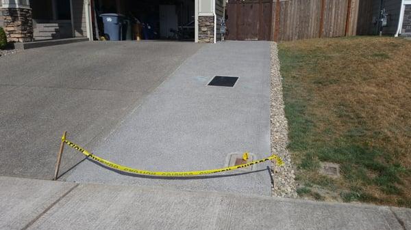 6' x 53' extention to exposed aggregate finished driveway with utility boxes raised to meet the level of the new driveway.