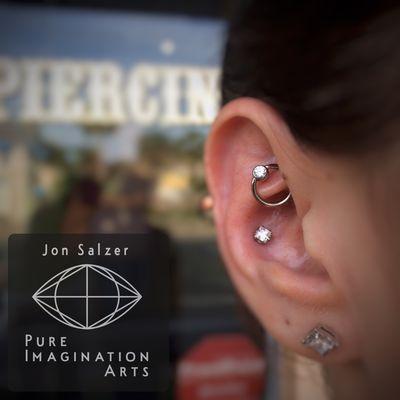 Princess cut in a conch and gemmed captive bead in a rook