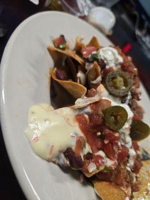 Nachos with queso and jalapeños...muy bueno!