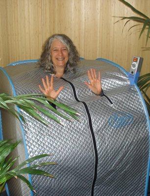 Dr. Connie demonstrates sauna available for purchase