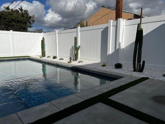 Clean, desert scape behind pool