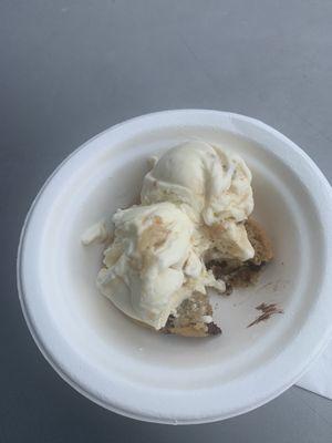 Warm cookie with ooey gooey butter cake ice cream and pecan vanilla salted Carmel brittle ice cream