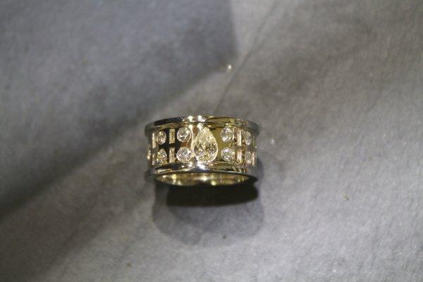 This white and yellow gold ring features diamonds from four of our customer's family members!