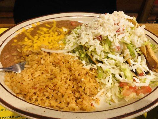 Chicken Tacos with Spanish rice and Re-fried beans.