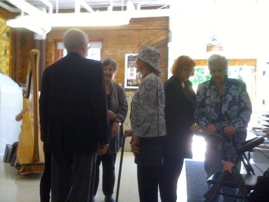 Artist Laureate Kay Smith with students and patrons at the opening reception