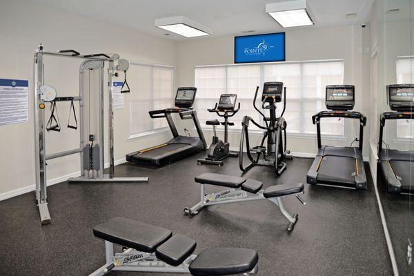 The Pointe at Neptune's fitness center offers a variety of premium equipment