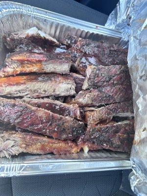 2 slab of ribs in a tray