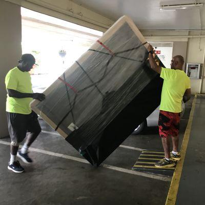 Wrapped box spring being transported and staying clean.