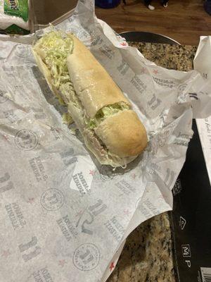 Sandwich with top ripped off in pieces