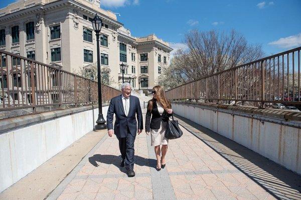 Attorneys Andrew Romano & Karly Grosz walking back from the Court House