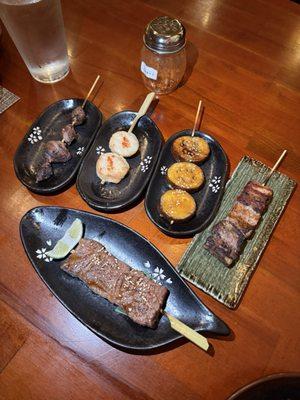 Gizzard, scallop, eggplant, pork belly, beef yakitori (in front)