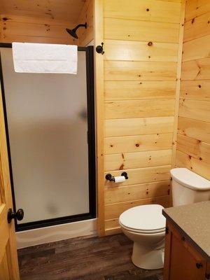 Full bathroom with standing shower in Lakeview & Upper Lakeview Single-bedroom Cottages.