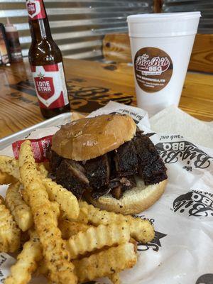 Brisket moist cut sandwich, buttered toasted buns, and generously seasoned crinkle fries.