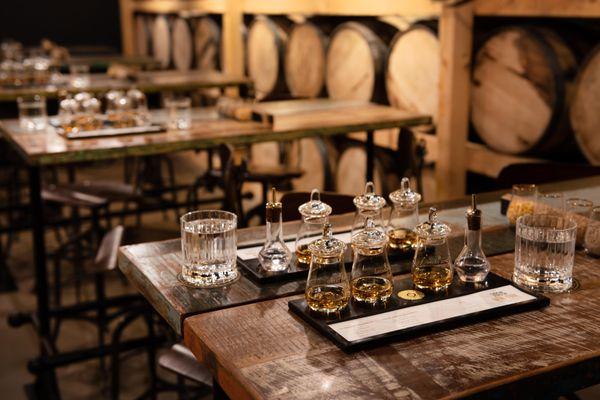 Taste four whiskey expressions in our barrel room.