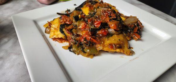 Red & green bell pepper sautee with caramlized white onions & baby spinach cooked cohesively with a mushroom ravioli.