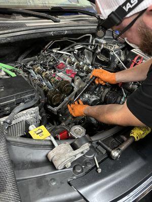 Our mechanic putting a motor back together after getting heads done.