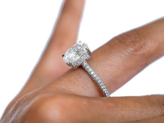 2.5ct Oval Moissanite in a tri-pave diamond encrusted setting