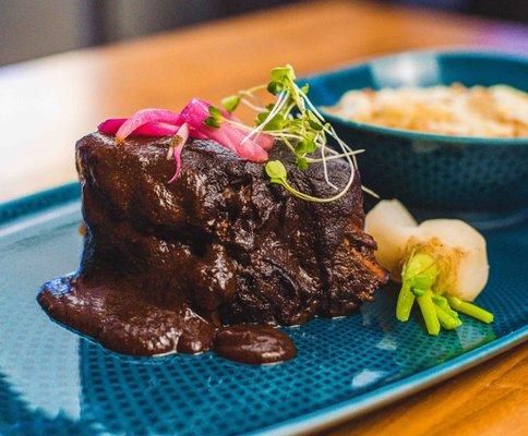 Short Ribs en Mole Chichilo - braised boneless short ribs, Chef's version of dark mole, au gratin fideo