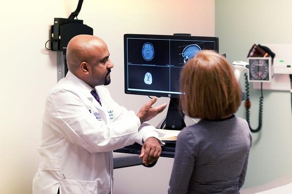 Dr. Santosh Kesari with a patient at Pacific Brain Tumor Center, Santa Monica, CA