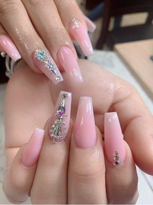 Classic meets glam--pink and white ombré nails with rhinestones that shine as bright as you do