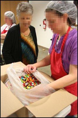 GTI staff sorting candy.