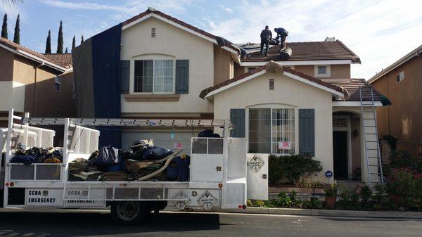 Oscar's team working on sealing up the house.