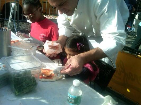 Starting Early..Learning the art of making pizza from the chef at Serrafina..