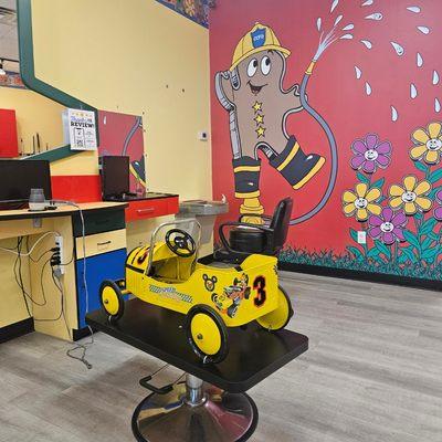 Fun cars, TVs, balloons, lollipops! Always making haircuts fun!