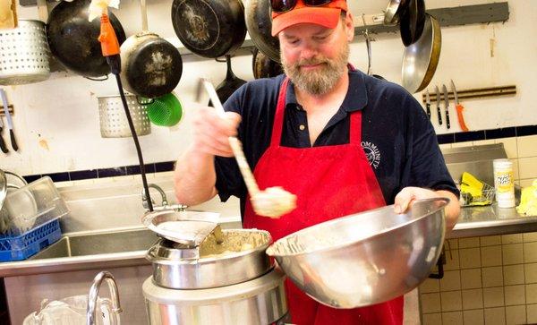 Kitchen employee Mike at the pasta plating station during a Friday Lunch Restaurant.