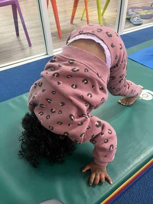 Toddler attempting a handstand