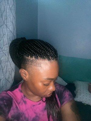 Box braids on undercut Afro.