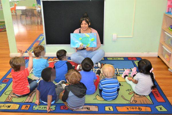 Ms. Annie reading to the Hungry Caterpillars