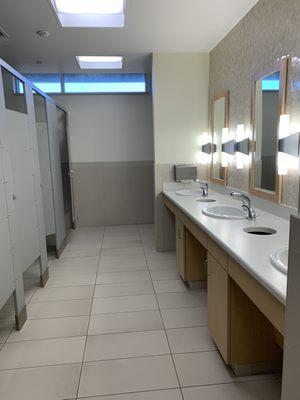 Super clean restroom (changing table is to the right at the end of the stalls).