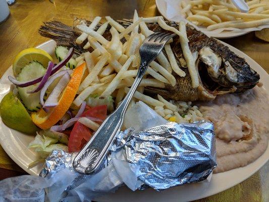 Fried tilapia - flavor was off, cold beans and weird rice w fries tossed in, very strange