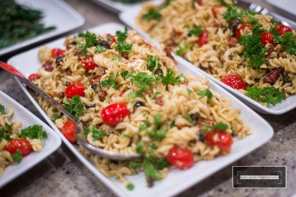 Puttanesca pasta salad with tomatoes, olives, parsley...